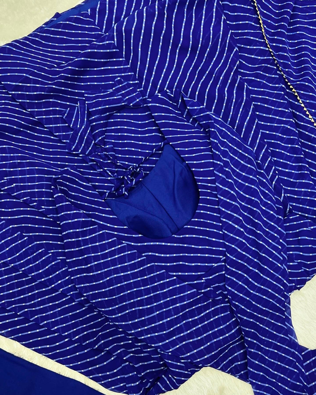 Royal blue striped Anarkali suit set flat lay