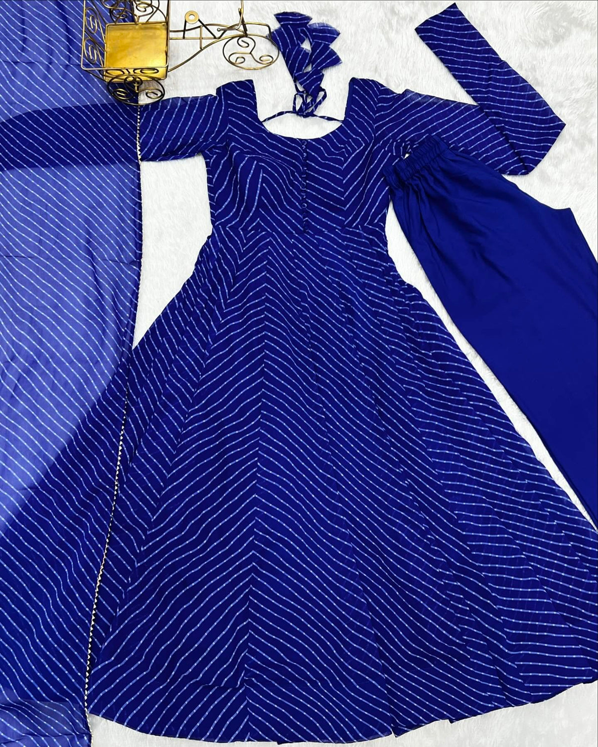 Striped Anarkali suit and coordinating trousers detail