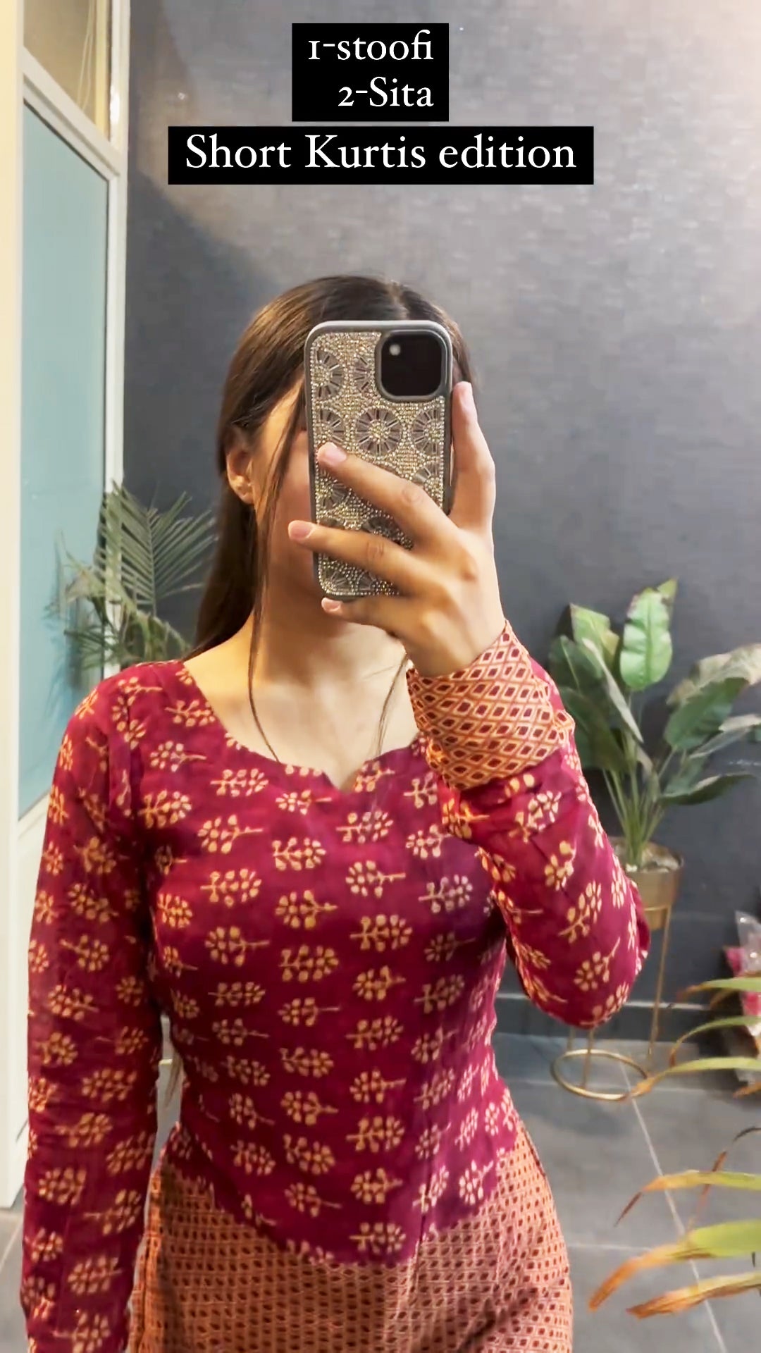 Woman wearing maroon and rust printed short kurti