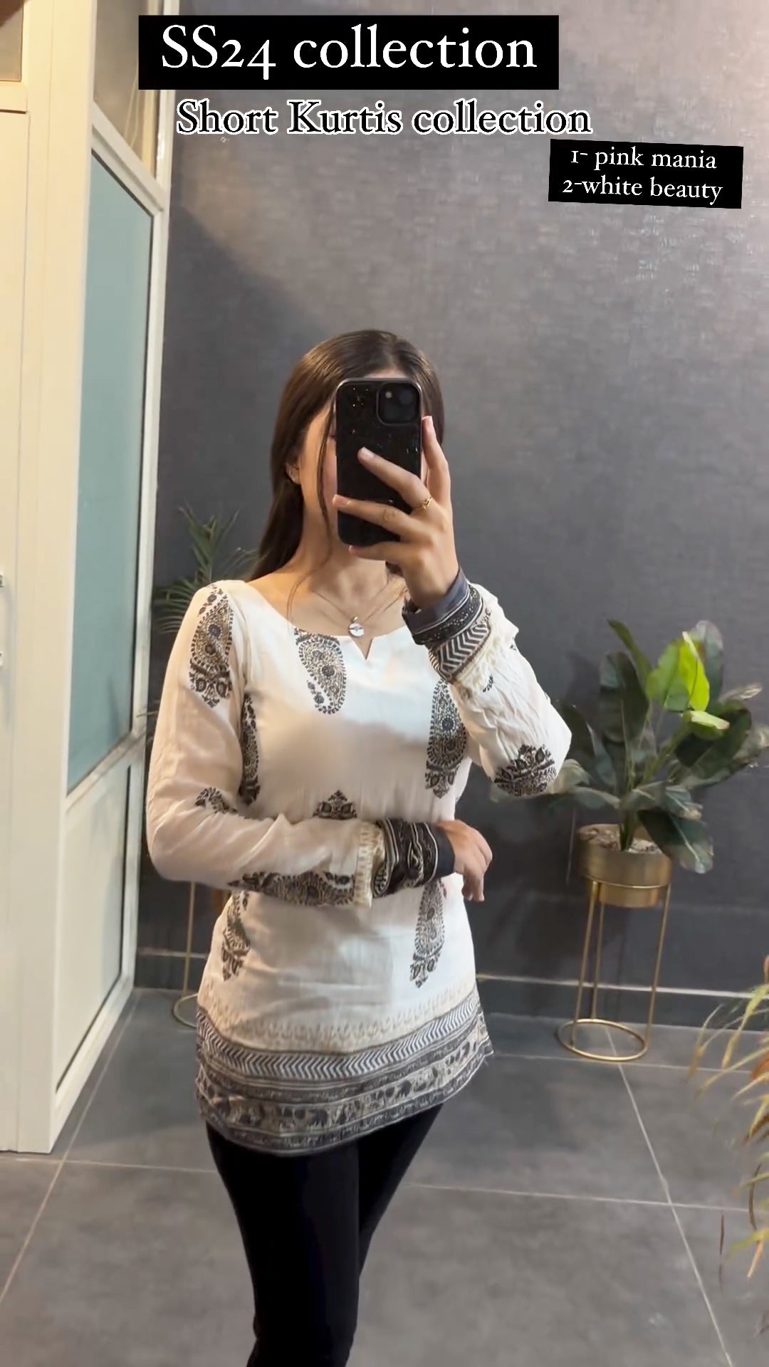 Woman wearing white and black printed short kurti