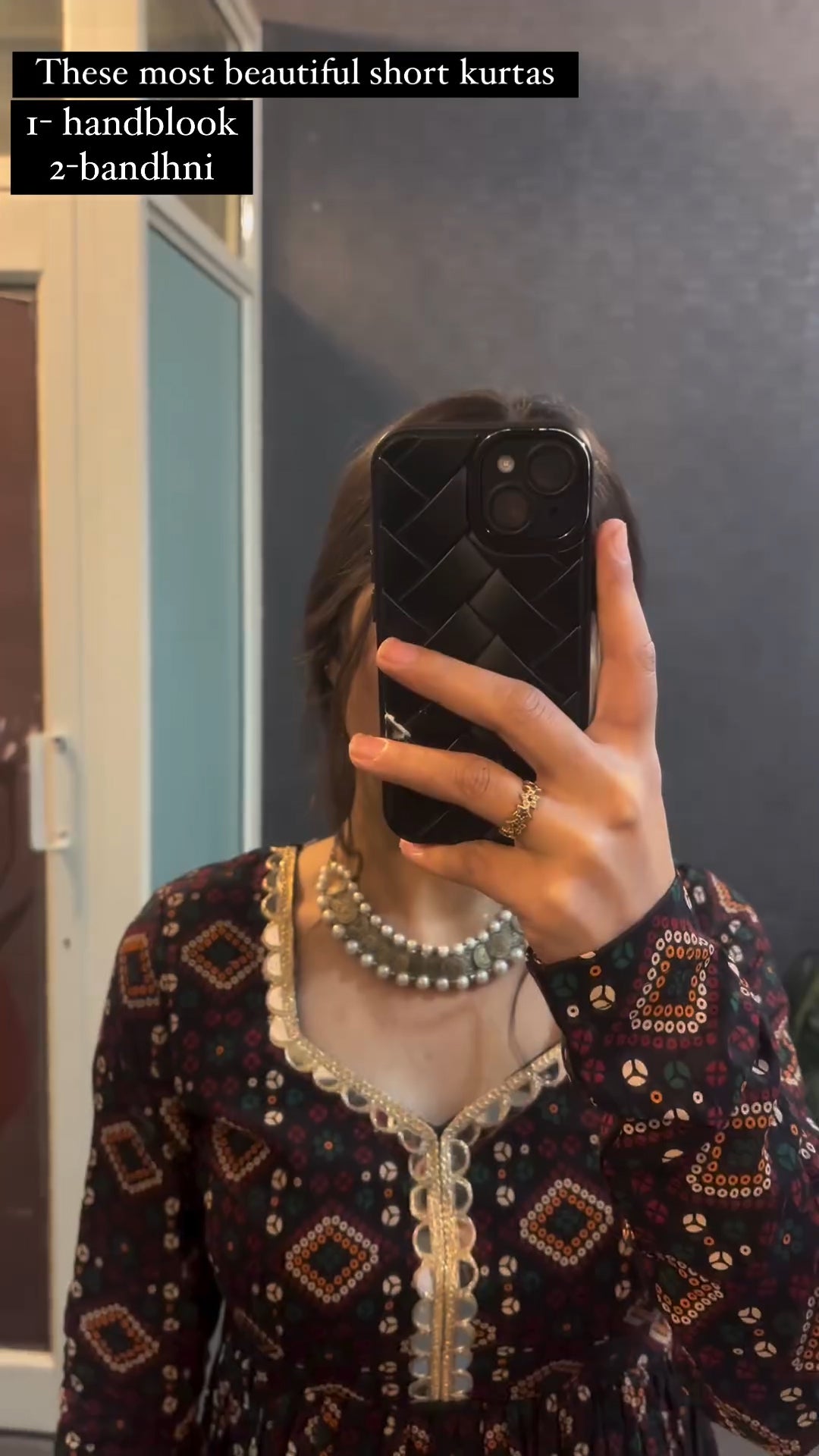 Woman wearing brown bandhej print short kurti
